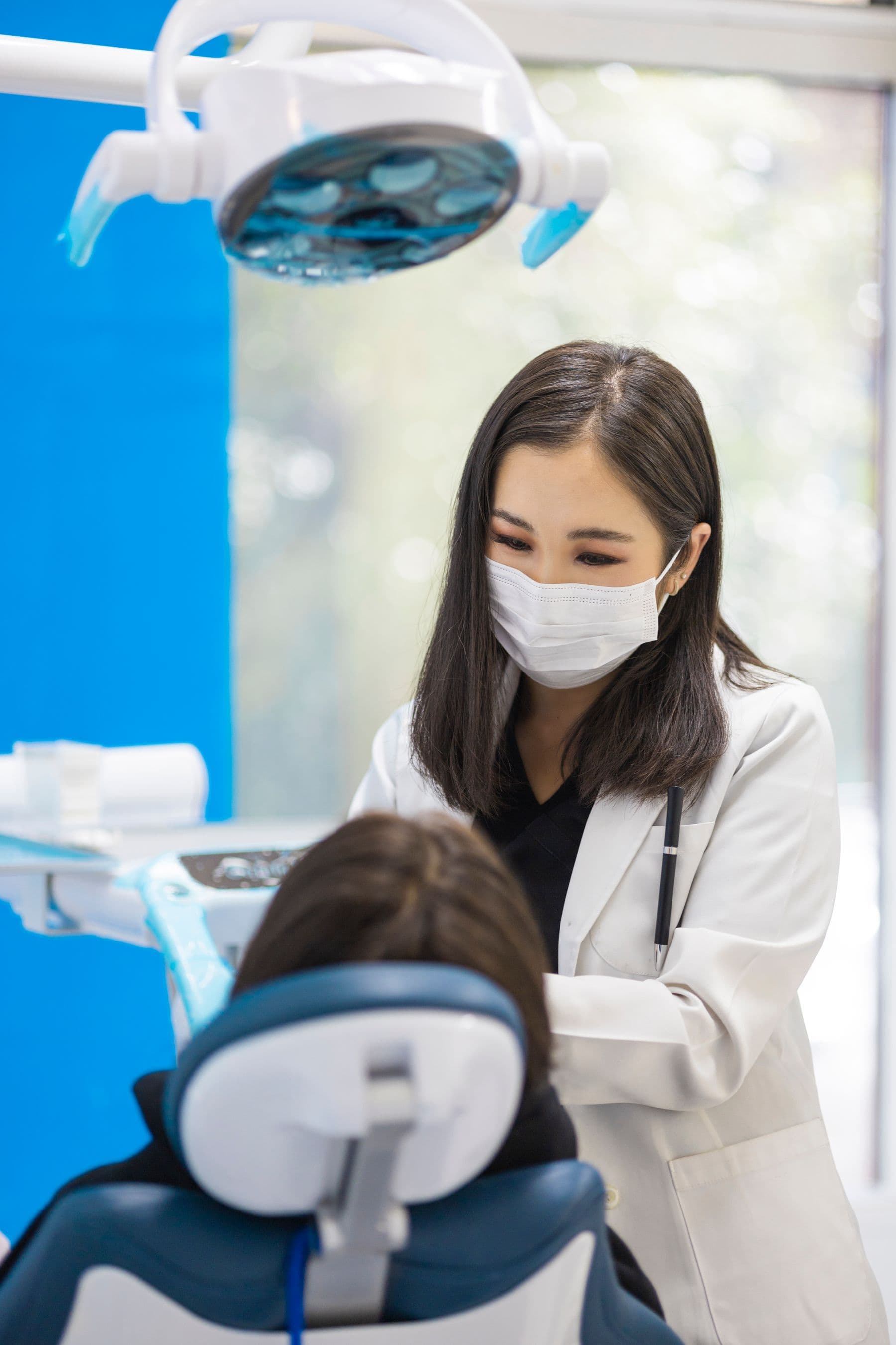Dentist providing attentive clinical care